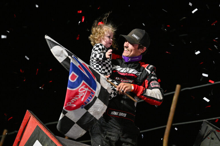 Hank Davis celeberates with his daughter on the top wing