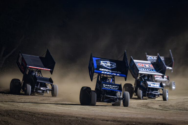 Andrew Deal leading a pack of cars