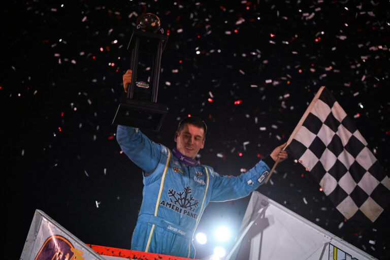 Derek Hagar with his trophy on top of the wing